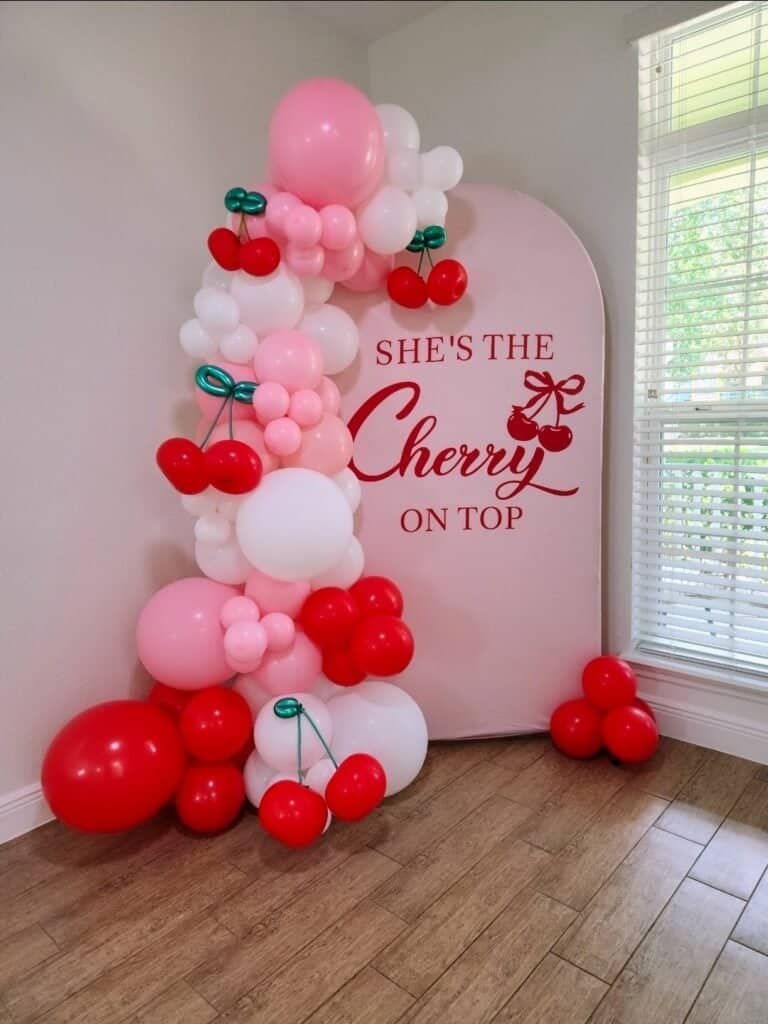 cherry balloon backdrop with 7ft garland orlando